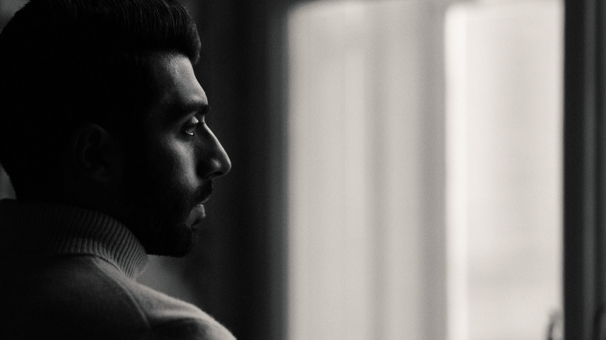 Mohammad Allagha looking out of a window