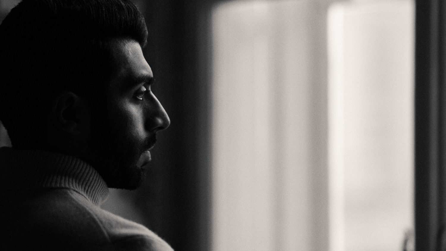 Mohammad Allagha looking out of a window